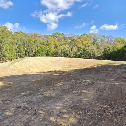 Graded pond basin prepared for water retention