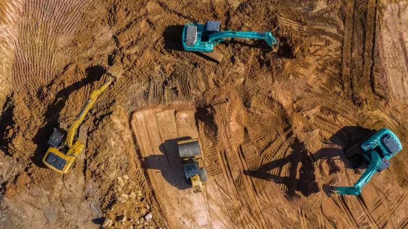 excavator-digging-utility-trench-on-rural-texas-land