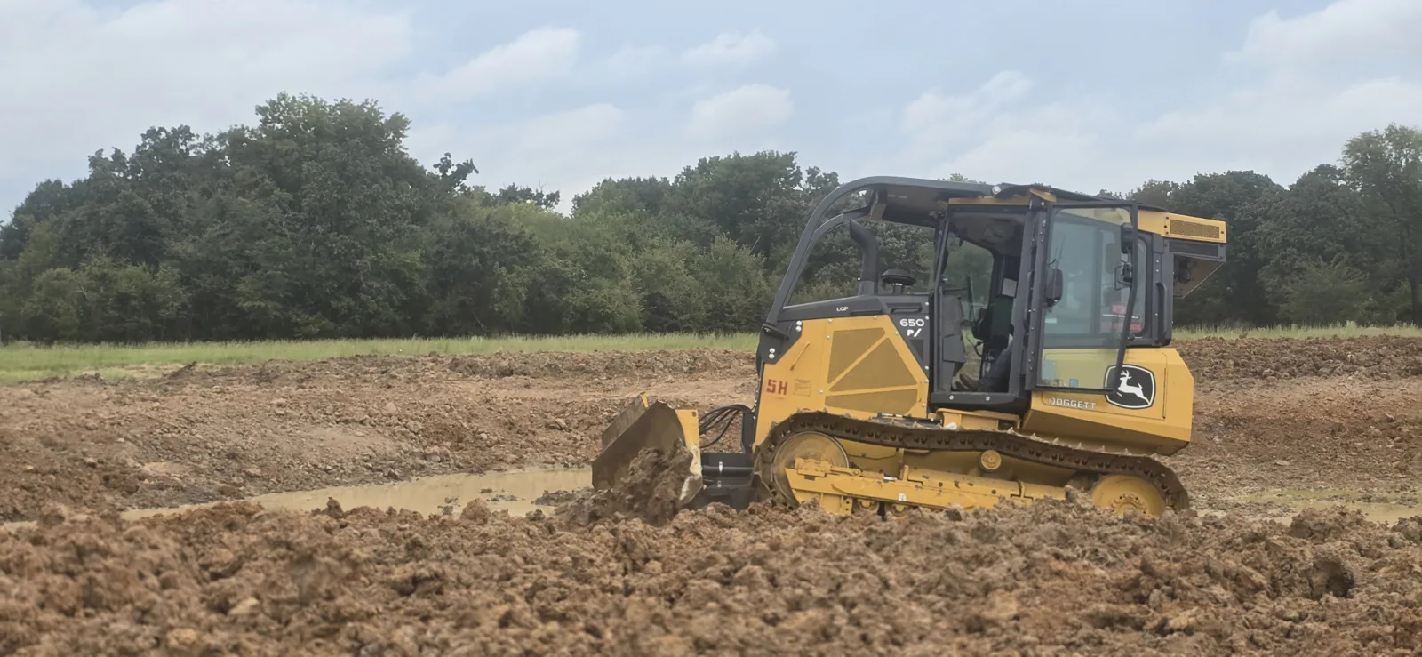 Bulldozer clearing an East Texas property for winter land preparation
